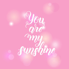 Fototapeta na wymiar You are my sunshine - Hand made inspirational and motivational quote on pink background. Lettering calligraphy phrase. Happy Valentine's Day.