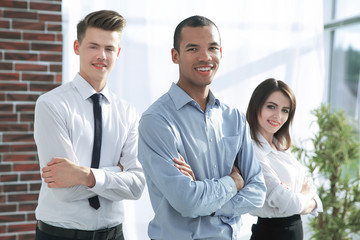 group of successful colleagues on the background of the office