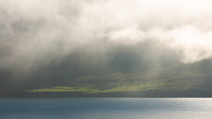 Fog building up on the shores of Faroe Islands