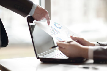 close up.colleagues discuss the financial report, the concept of planning