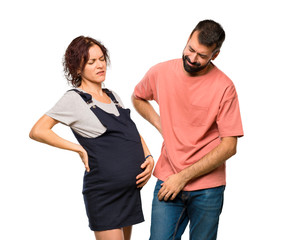 Couple with pregnant woman suffering from backache for having made an effort on isolated white background