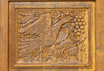 Woodcarving on the entrance gate of a church. Asenovgrad, Bulgaria.