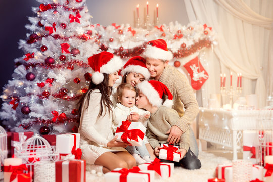 Christmas Family Front of Xmas Tree Opening Present Gifts, Happy Father Mother Children and Baby