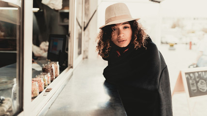 Obraz premium Girl in Black Plaid Buying Snacks in Food Truck.