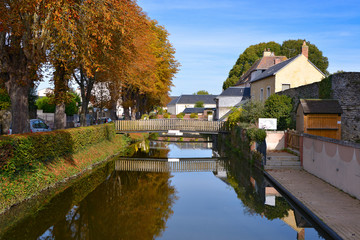 Naklejka premium The Huisne river with reflection at La-Ferté-Bernard, a commune in the Sarthe department in the Pays de la Loire region in north-western France.