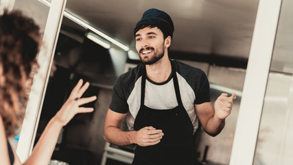 Girl in Black Dress Buying Coffee in Food Truck.