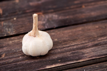 garlic on a dark wooden background