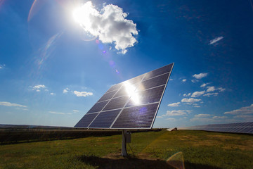 Solar panel on the tracker. A ray of sun hits the solar panel