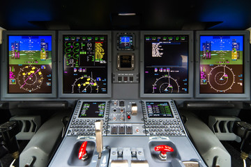 Closeup high detailed view on engine power control and other aircraft control unit in the cockpit of modern civil passenger airplane - obrazy, fototapety, plakaty