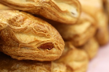 Puff pastry with jam, close-up. Freshly baked rolls for breakfast