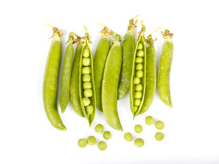 Green peas and pea pods on white background