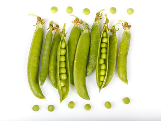 Green peas and pea pods on white background