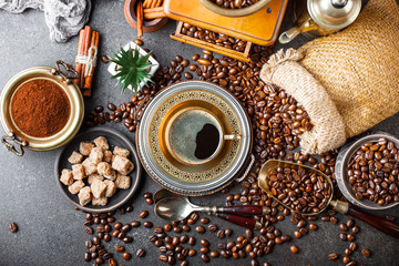Black coffee in a composition with kitchen accessories