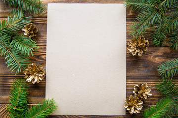 Golden pine cones and fir tree branches, mock up. COpy space.