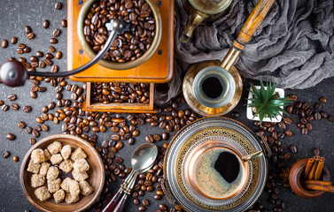 Black coffee in a cup on old background