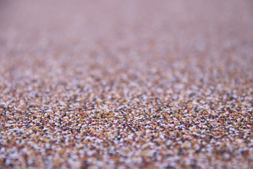 Horizontal texture of multicolored small stones and copyspace