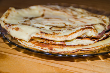 Photograph of some crepes or pancakes with chocolate.