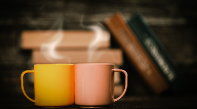 Two Cups And Books In Bokeh On Background.