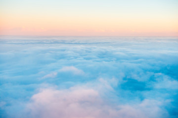 Sky and clouds at sunset, aerial view from plane