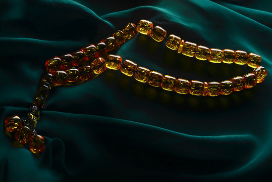 Ramadan Karim greeting background Islamic prayer bead (rosary). Ramadan Kareem beautiful poster, banner, postcard for the celebration of the festival of the Muslim community