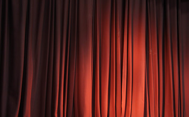 Red curtain on empty theatre stage and 