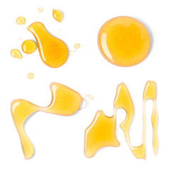 Set with honey drops on white background, top view