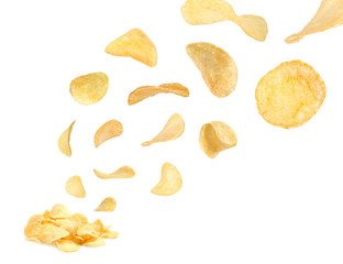 Tasty potato chips falling on white background