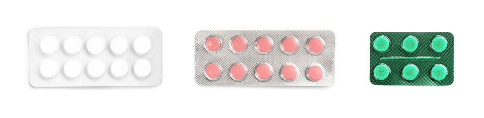 Set with pills on white background, top view. First aid