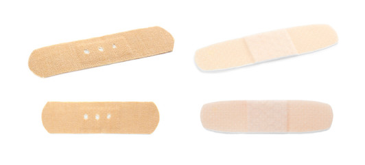 Set with adhesive plaster on white background. First aid