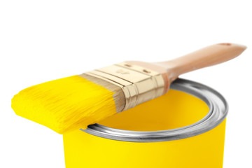Paint can with brush on white background, closeup