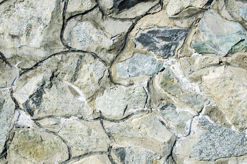 Masonry texture. Grungy uneven stone.