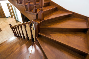 Close-up detail of brown wooden stairs © bilanol