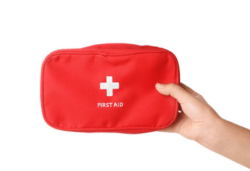 Woman holding first aid kit on white background