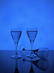 Three wine glasses on bokeh background, alcoholic drink for a party.