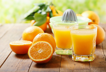 glass of fresh orange juice with fresh fruits