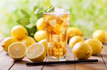 lemon iced tea in a glass with fresh fruits