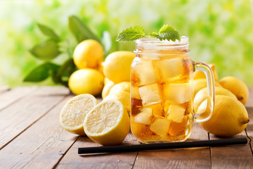 lemon iced tea in a glass jar with fresh fruits
