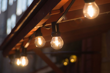 Glowing incandescent lamp with soft light background