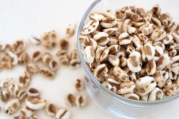 Puffed wheat cereal in a glass - healthy breakfast