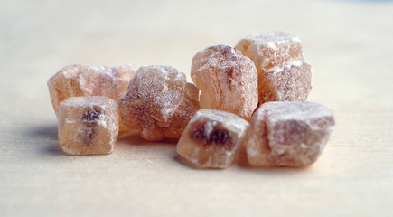 Lumps of brown sugar. Closeup view