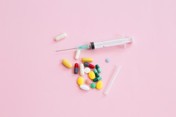 various drugs, tablets and needles, background. top view.