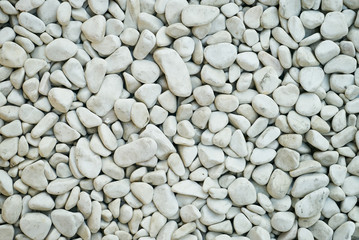 White pebbles stone texture background with copy space