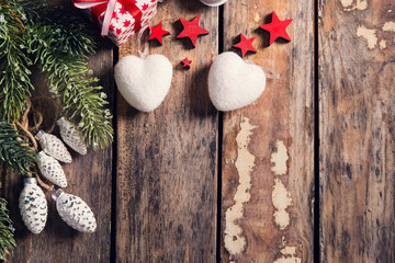Gift box with stars and heart on dark wooden background