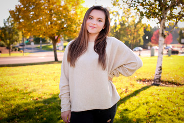 Portrait of Pretty Smiling Girl 16-17 years old, Teenager, with Brown Long Hair and Big Brown Eyes, in a Beige Sweater,  in the Golden Autumn, Portland Oregon