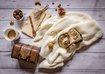 Autumn composition.Old letter, coffee, cone and scarf on wooden background