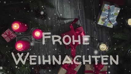 Animation Frohe Weihnachten - Merry Christmas in german, white letters, red candles and gifts, falling snow - Powered by Adobe
