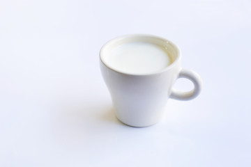 Cup of  milk on white background