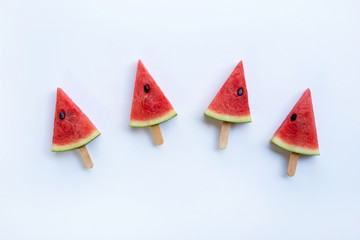 Sweet watermelon slice popsicles on white background