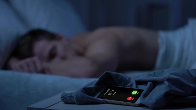 Ex calling, young man sleeping on background, missed call, broken relations