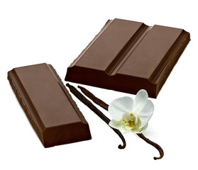 Broken dark chocolate bars with vanilla beans isolated on white background